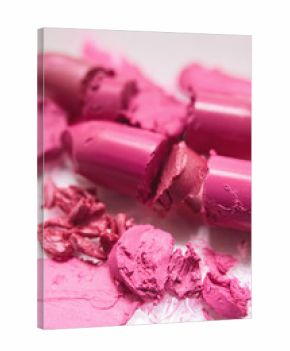 Lipsticks pink broken on white background. Cosmetics commercial, beautiful style, creative advertising, beauty concept