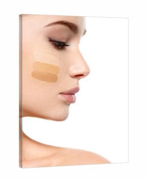 Young woman with cosmetic foundation on skin.