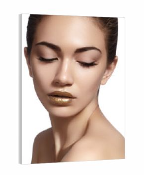 Closeup portrait with of beautiful woman face. Gold color of fashion lip makeup, clean shiny skin and glitter lipgloss