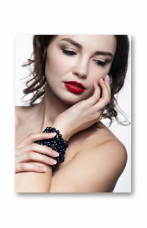 Portrait of young brunette woman on white background. Girl with necklace on the wrist