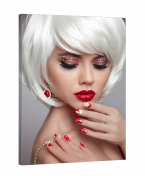 Christmas makeup. Red lips Make-up. Beautiful blond closeup portrait. Manicured nails. Jewelry. White Short bob hairstyle. Sensual blonde woman with xmas eye shadow. Vogue style.
