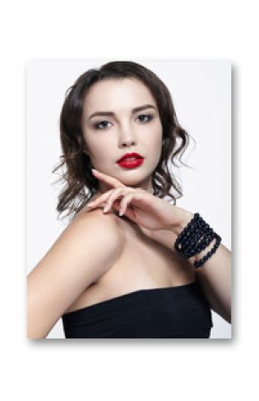 Portrait of young brunette woman on white background. Girl with necklace on the wrist