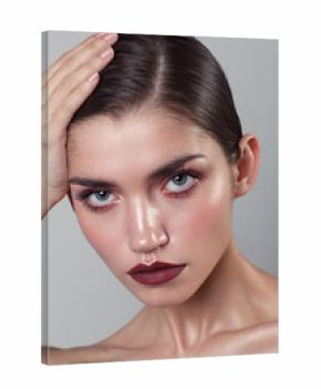 Beauty portrait of woman with wet skin and and dark lipstick