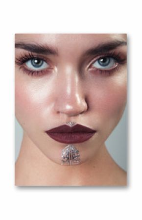 Beauty portrait of woman with wet skin and and silver tatoo
