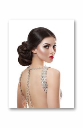 beauty fashion portrait of a beautiful model in an evening dress embroidered with stones.