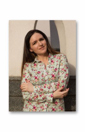 Street portrait of happy brunette woman with beautiful makeup posing at sunset