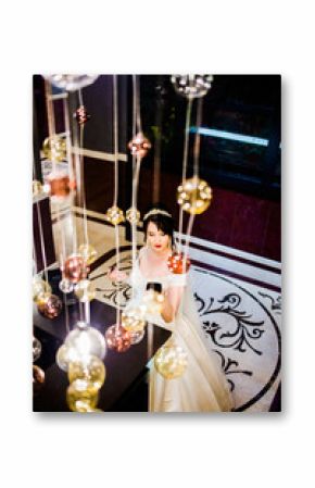 Amazing bride makes makeup in the hotel lobby