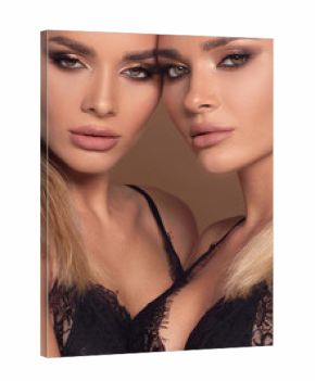 Portrait of two attractive women in glamour makeup.