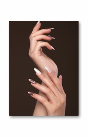 Beautiful classic manicure with crystals on female hand. Close-up. Picture taken in the studio