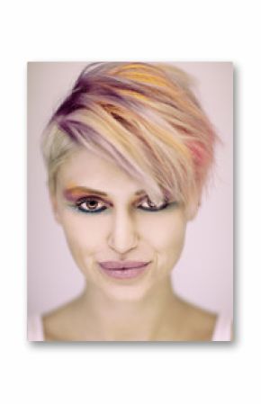 Fashion beautiful blonde woman with short haircut and colorful pastel hair and make up