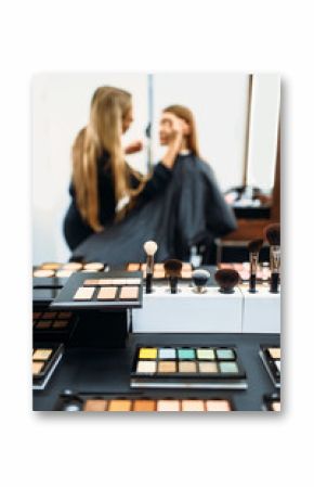 Makeup artist works with customers face