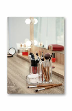 Makeup cosmetic products and tools on dressing table