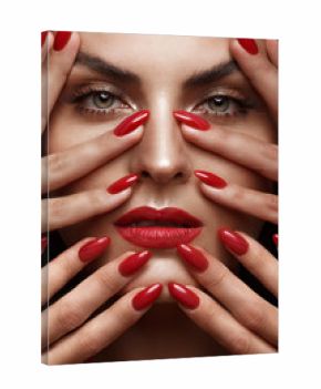 Beautiful girl with a classic make up and multi-colored nails. Manicure design. Beauty face. Photo taken in the studio