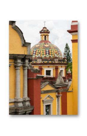 Orizaba, Veracruz, Mexico - July 14, 2022: Cloudy sun shines on the historic core and churches of downtown Orizaba.