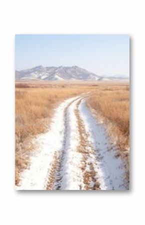 Snowy Path Through Open Steppe Leading to Distant Mountains