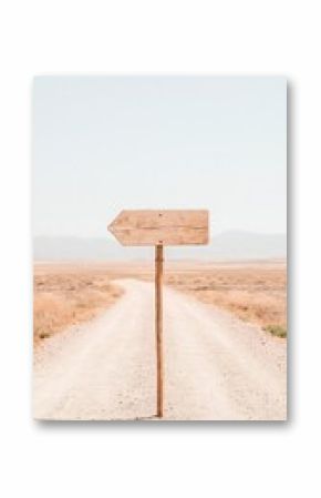 Wooden Arrow Sign on a Desert Road