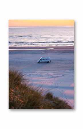 Coastal camping adventure at sunset in a serene Danish beach landscape