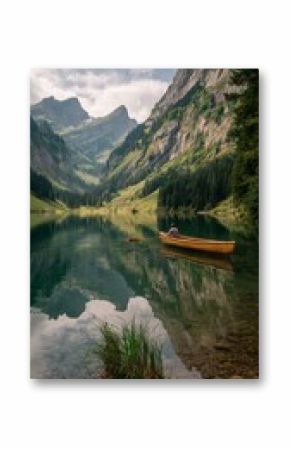 Rowing on a Tranquil Lake Surrounded by Mountains in Summer