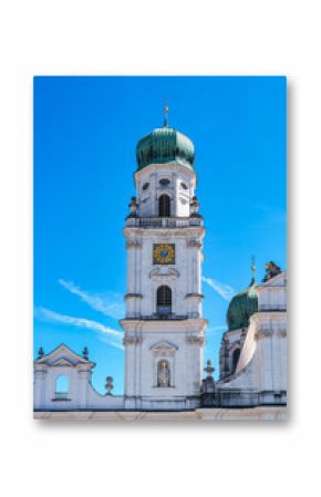 St. Stephans cathedral in Passau, Germany is an old white church with green metal domes on top of the towers