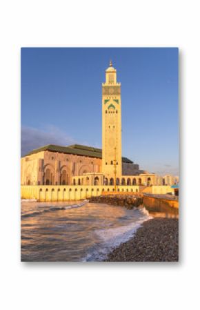 Casablanca, Morocco: Sunset over the famous Hassan II mosque and minaret by the Atlantic ocean in Casablanca, Morocco largest city.