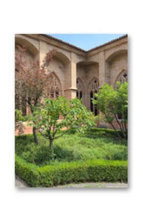 Exploring the tranquil courtyard of Catedral de Siguenza in Spain during a sunny afternoon