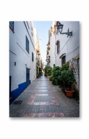 Marbella old town in Andalucia Spain. Typical Spanish village whitewashed houses narrow street 