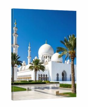 White mosque under a clear blue sky