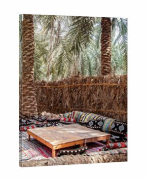 beautiful carpet seats in garden with palm trees in Siwa oasis Egypt 