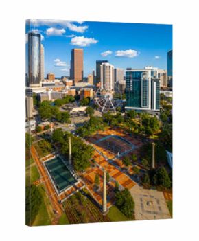 Daytime aerial view of downtown Atlanta skyline with parks, buildings, and clear skies