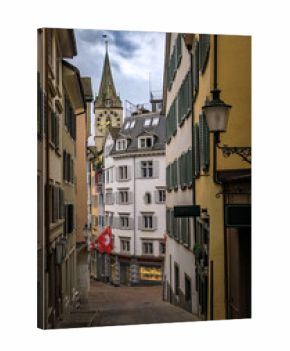 St Peter Church clock tower framed by historic buildings in Zurich, Switzerland