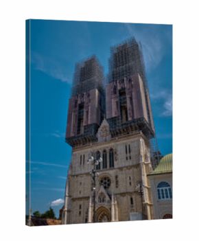 Zagreb, Croatia – July 18, 2025: The iconic Zagreb Cathedral under extensive restoration, with scaffolding surrounding its twin towers. 