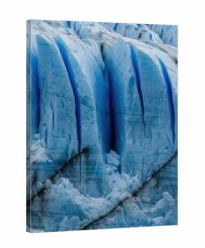 Majestic blue glacier with cracks and textured ice formations in natural landscape