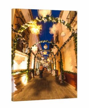 Zacatecas streets at dusk, in winter, with Christmas and New Year lights and decorations