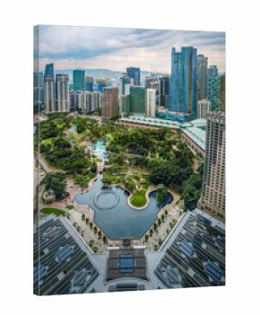 Aerial view of KLCC Park, Kuala Lumpur, Malaysia, with dramatic sky at