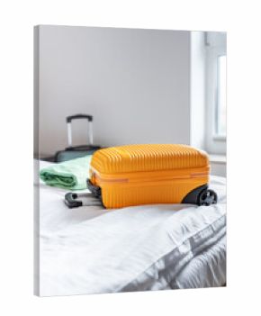 Travel suitcase on hotel bed preparing for journey