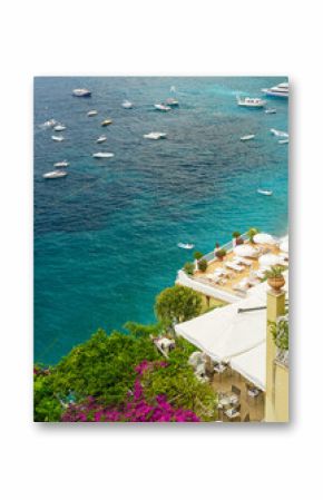 A beautiful view of the blue Tyrrhenian ocean and a hotel in Positano, Italy. This city, located on the Amalfi coast, is a guarantee for amazing landscapes and is an ultimate travel destination.   