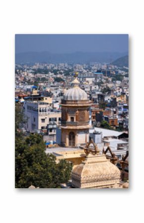 View of historic buildings and colorful homes in heritage city Udaipur in Rajasthan, India.