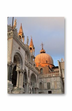 Evening light on the historic architecture of St. Mark's Basilica in Venice, Italy