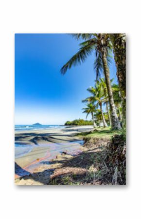 Beautiful beach and coast of Sao Sebastiao, black beach tropical island on the Brazilian sea coast during a sunny day of vacation and sightseeing. 