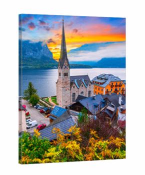 Hallstatt, Austria, Salzkammergut region: Misty autumn scenic morning view of Hallstatter See or Lake Hallstatt and the old town church in world famous alpine village in Upper Austria, Europe