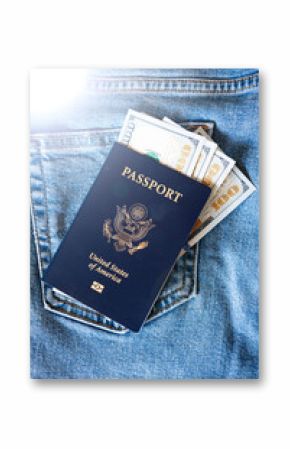 paper bills of 100 US dollars are inserted into an American passport against the background of blue jeans with highlights.