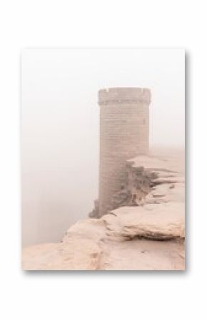 Solitary Stone Tower on Foggy Plateau