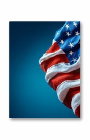 Waving American Flag Against a Blurred Blue Background in Daylight.