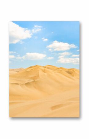Golden sand dunes of Ica desert under a clear blue sky in Huacachina, Peru