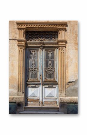 Old neoclassical building door with decorative wrought iron grilles in limassol, cyprus