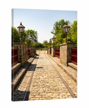 Tramlines over historical stone bridge
