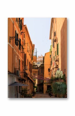 Romantic alley with orange facades and flower decorations France Corsica Ajaccio 10 June 2025