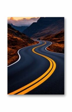 Winding mountain road at sunset