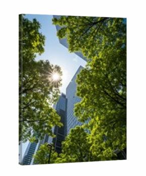 Urban skyscrapers framed by bright green trees