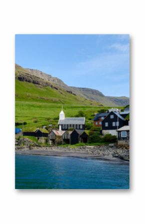 Explore the serene beauty of a village in the Faroe Islands with charming architecture